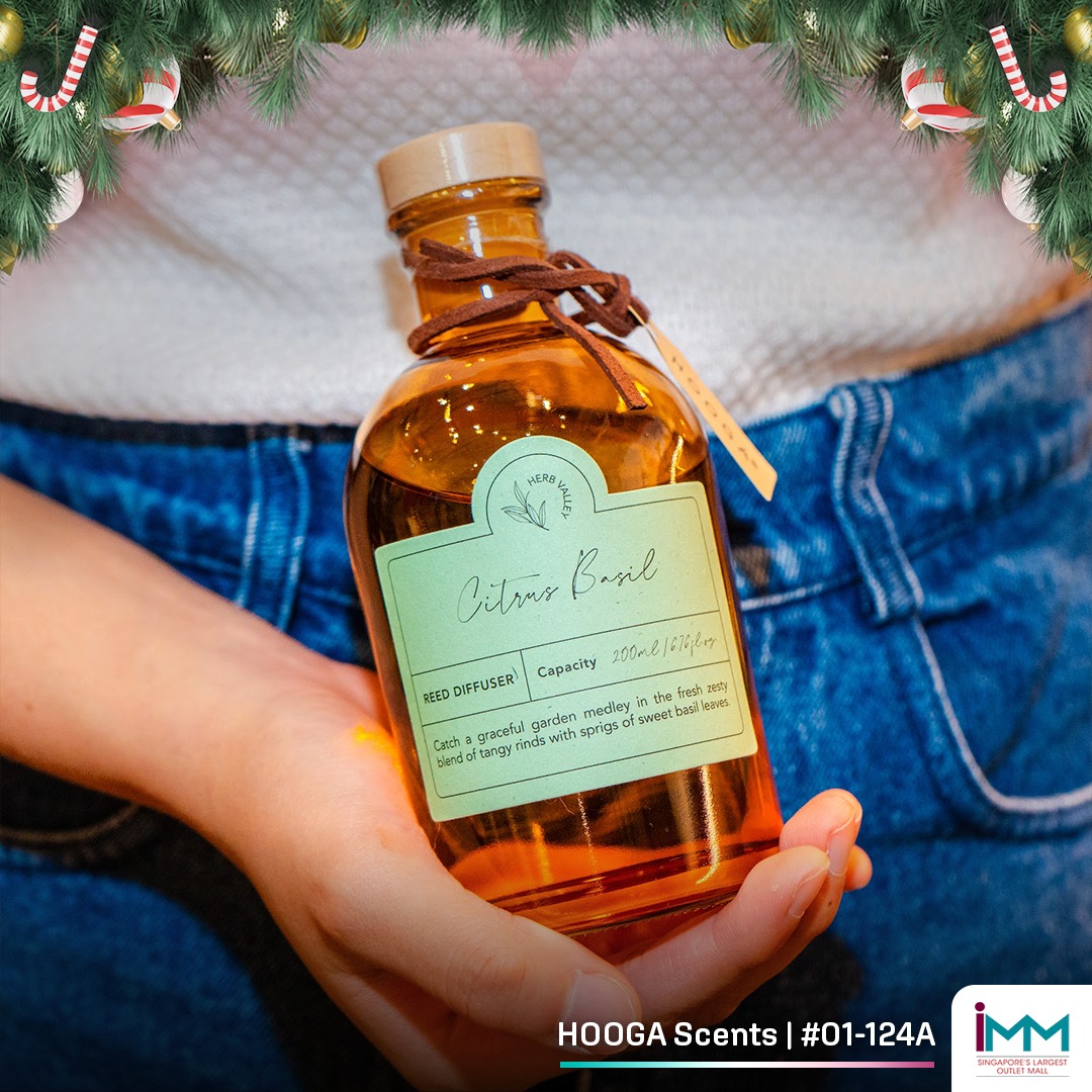 Cozy living room interior featuring HOOGA Scents diffusers and candles