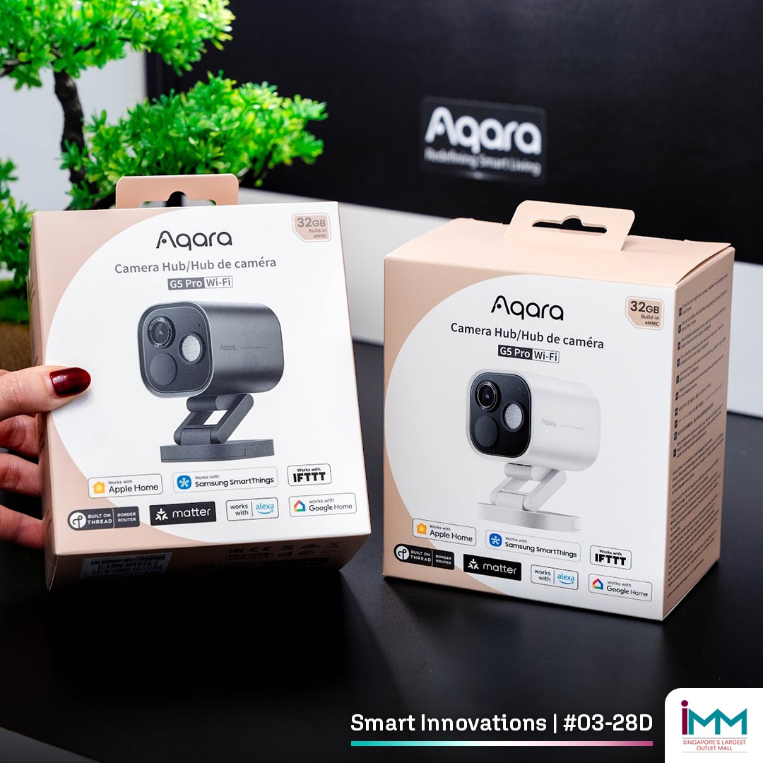 Detailed view of an Aqara motion sensor on a wall