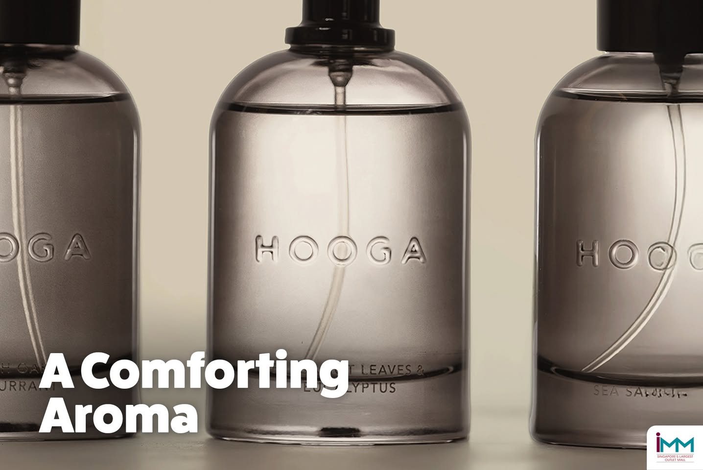 Luxurious HOOGA body lotion bottle beside a fresh towel, suggesting self-care.