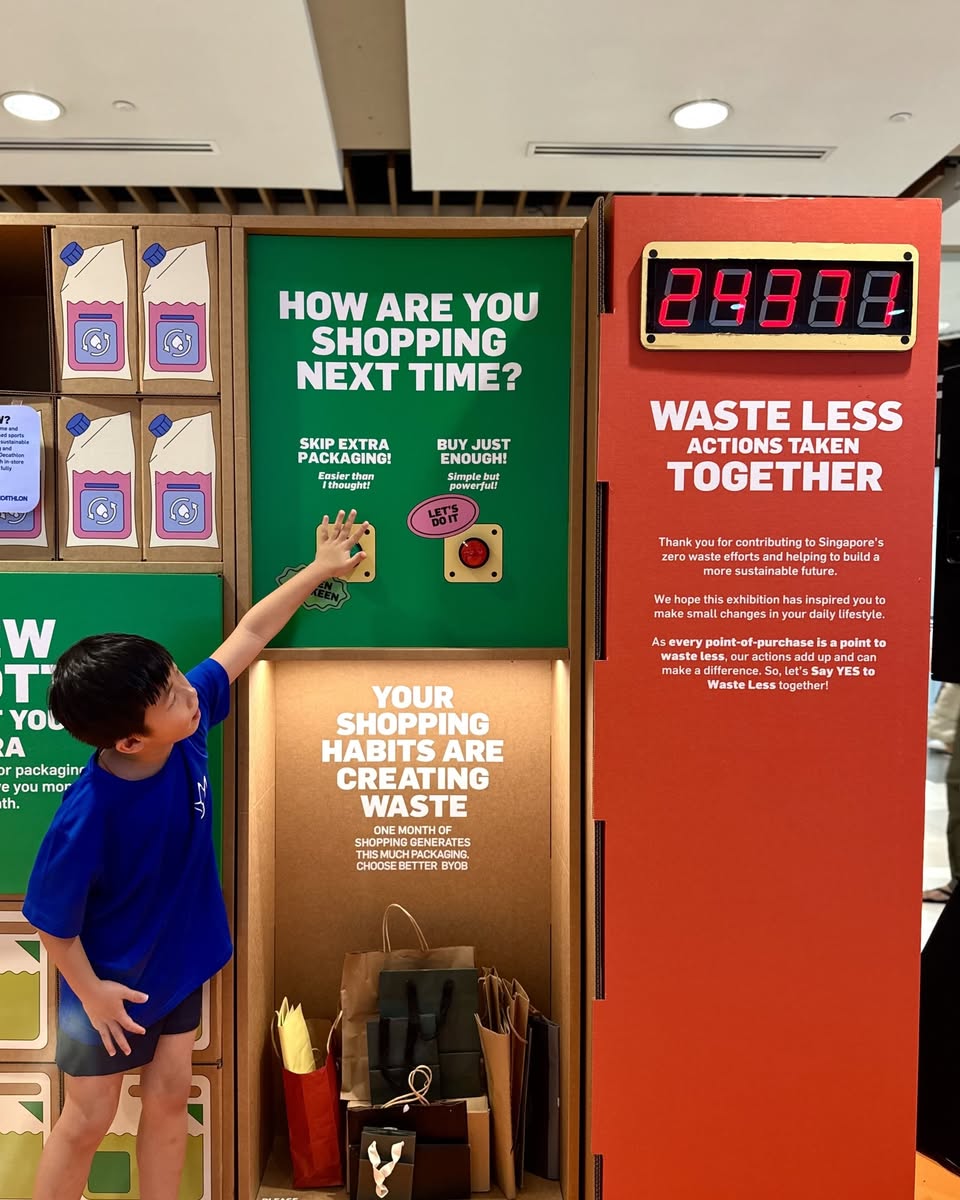 Shoppers at the Waste Less Supermart exploring eco-friendly options