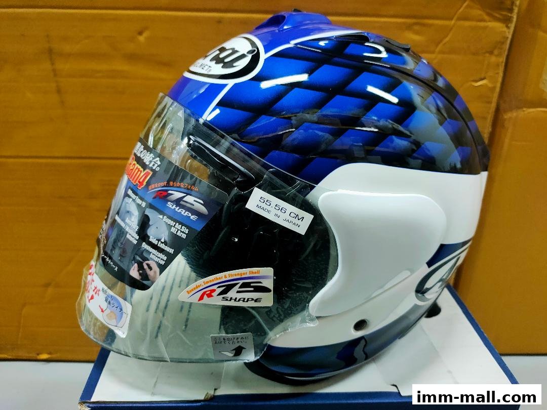 A blue and white Arai motorcycle helmet with a checkered pattern and clear visor.