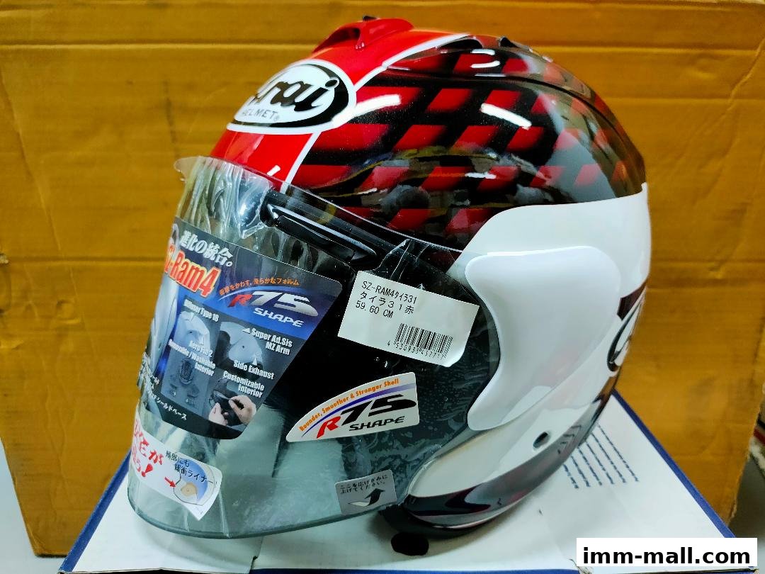 A red and black Arai Ram4 motorcycle helmet with a clear visor and product information.