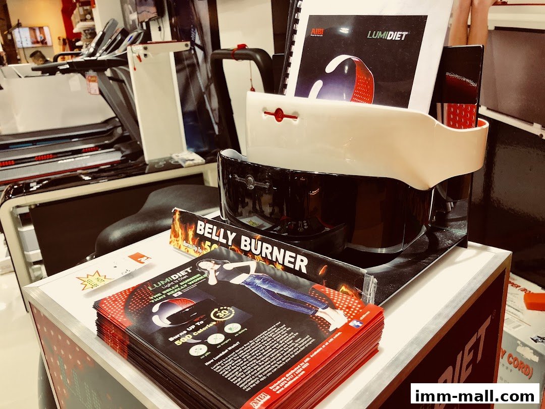 AIBI shop display featuring Lumidiet belly burner and treadmills.