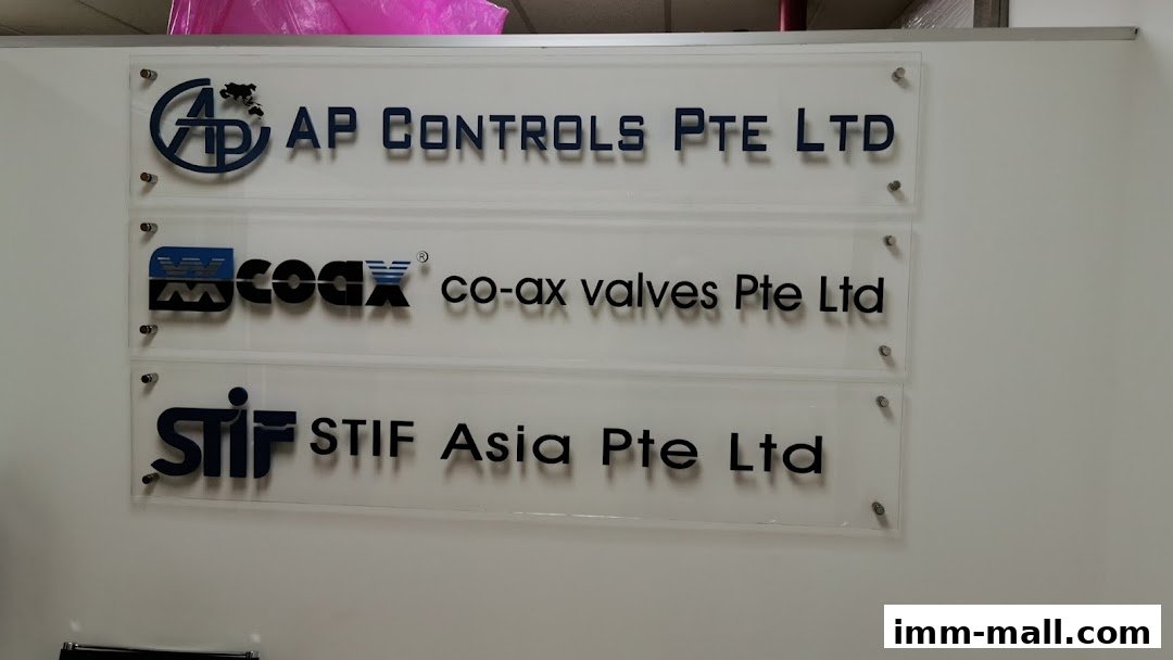 A sign with three company names: AP Controls Pte Ltd, co-ax valves Pte Ltd, and STIF Asia Pte Ltd.