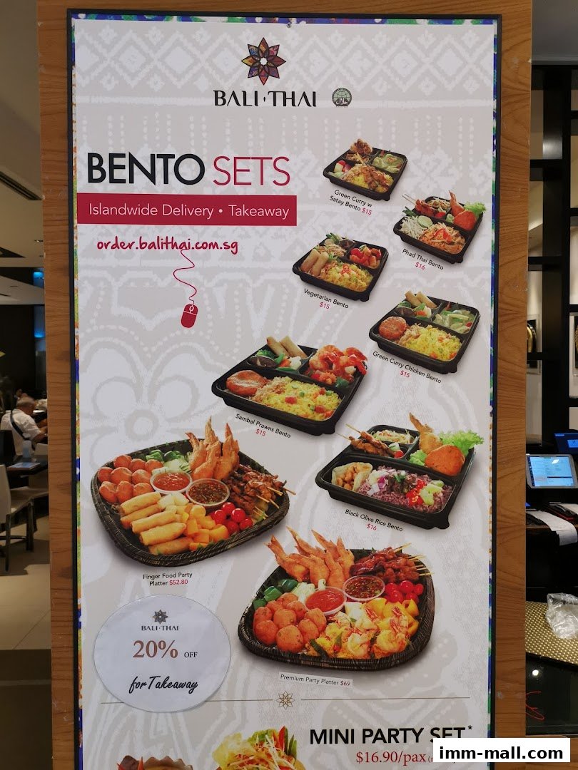 A menu board showcasing various bento sets, party platters, and a mini party set from Bali Thai.
