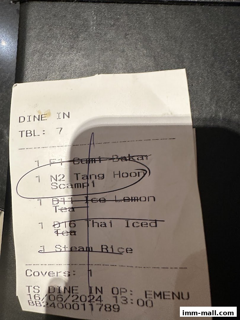 A receipt from Bali Thai IMM showing dine-in orders and transaction details.