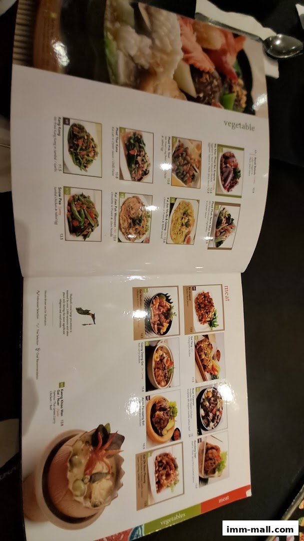 A menu from Bali Thai IMM featuring various Thai dishes with images and prices.