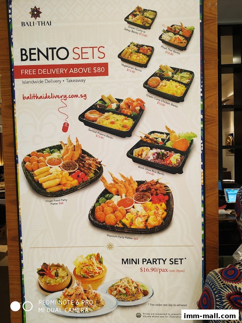 A menu board showcasing various bento sets, party platters, and mini party sets from Bali Thai.