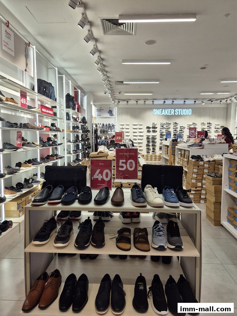 Interior view of a Bata shoe store showcasing various styles of footwear on shelves and display racks.