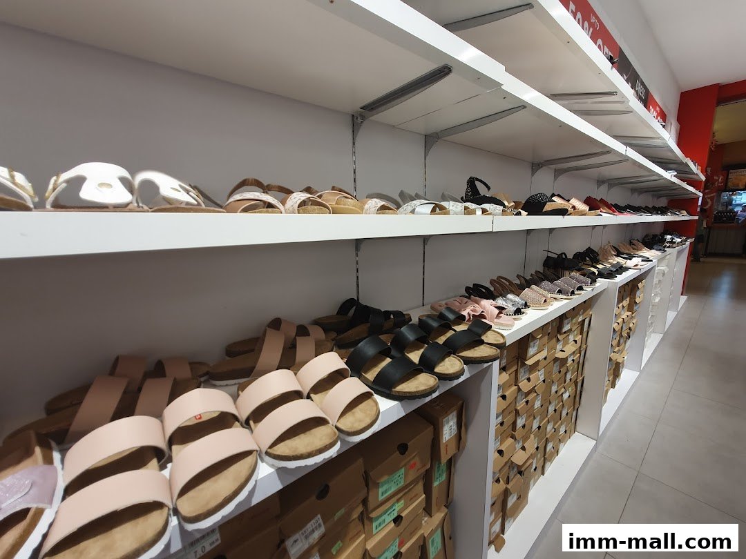 Shelves filled with various styles of sandals and footwear at Bata.