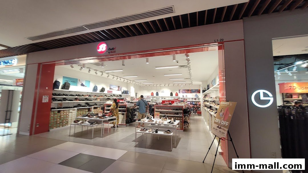 Interior view of a Bata shoe store showcasing a wide selection of footwear and bags.