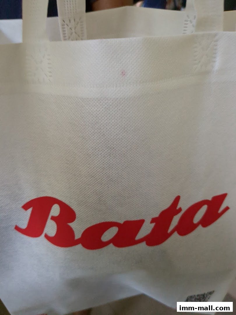 A white reusable shopping bag with the red Bata logo prominently displayed.
