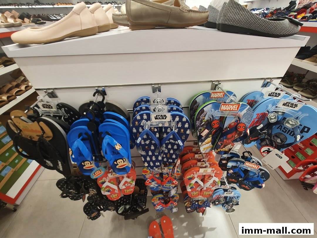 A display of various flip-flops and sandals, featuring popular characters like Marvel and Star Wars.