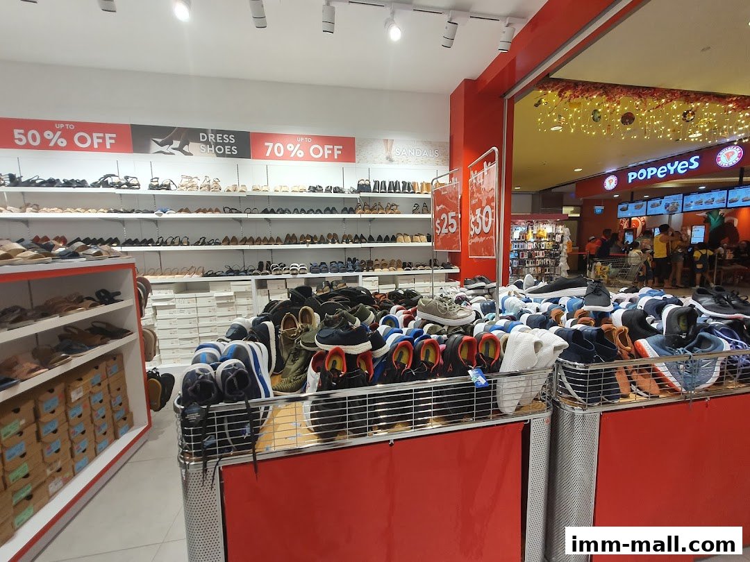 Interior view of a Bata shoe store with shelves of shoes and a display of discounted footwear.