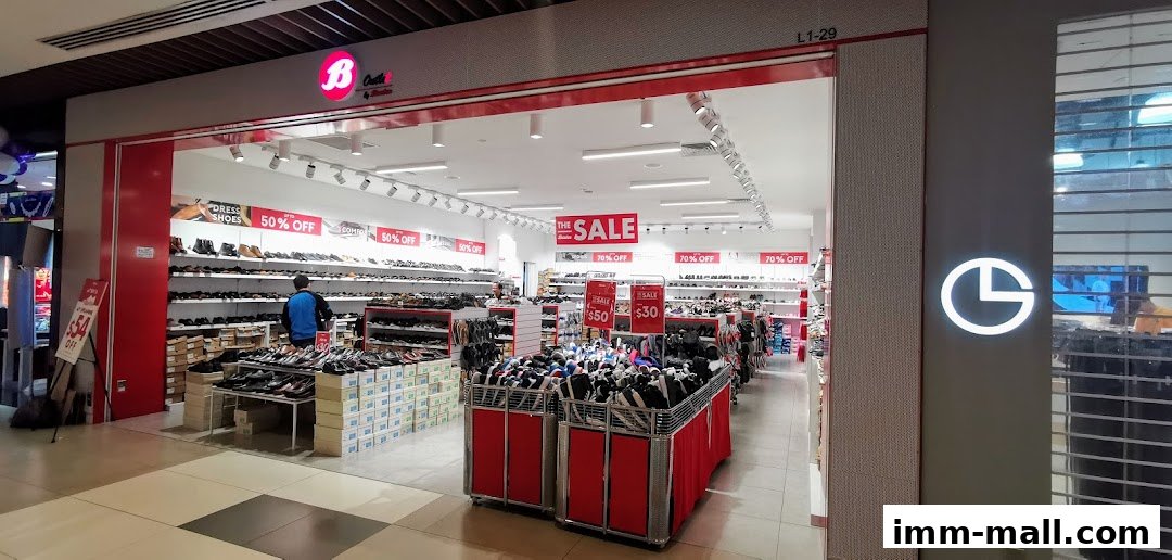 Interior view of a Bata shoe store with a large sale event happening.