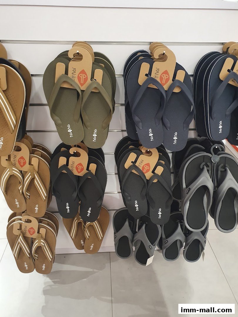 A display of various flip-flops and sandals in different colors and styles.