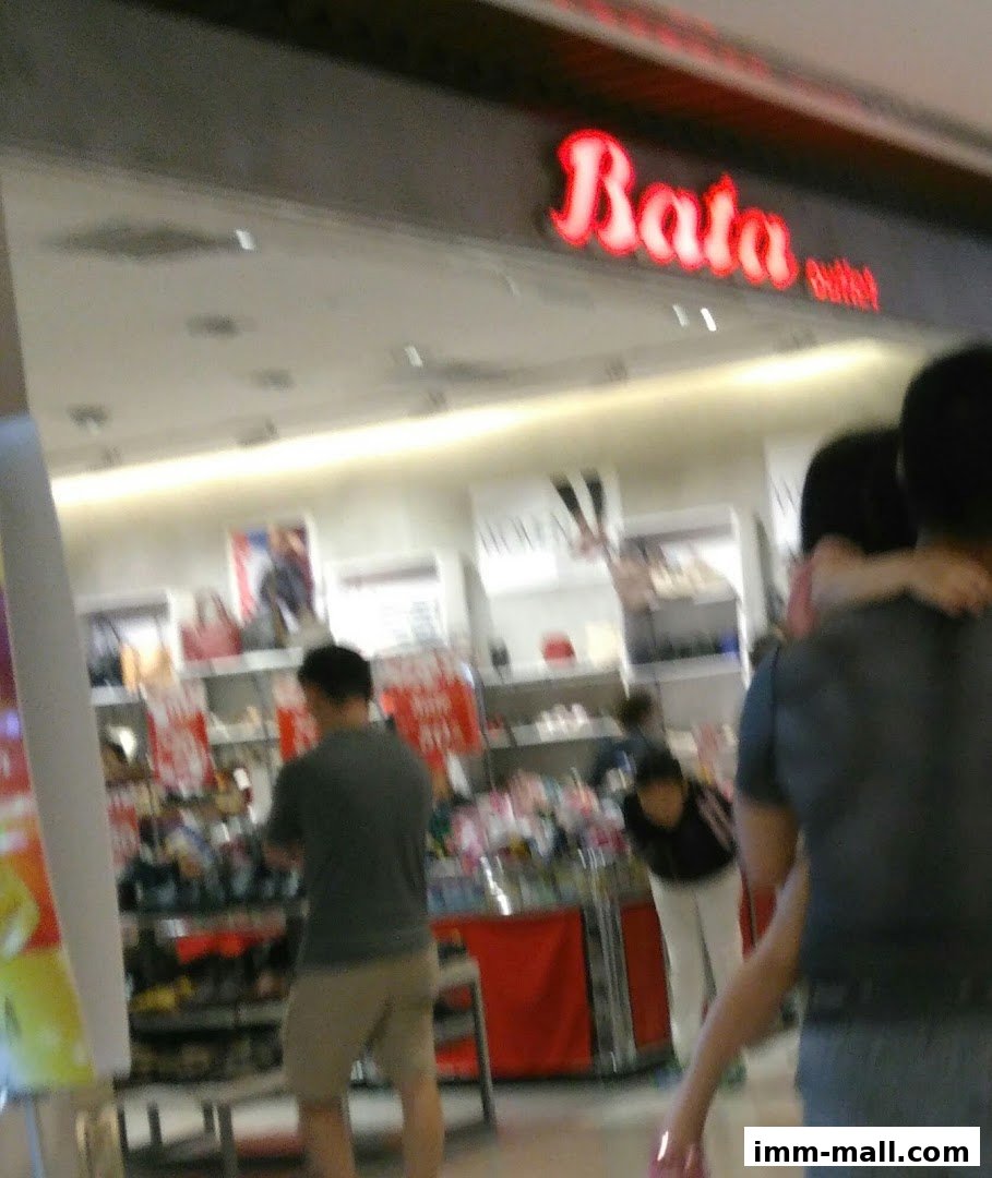 The Bata outlet store entrance with a prominent red logo and displays of shoes inside.