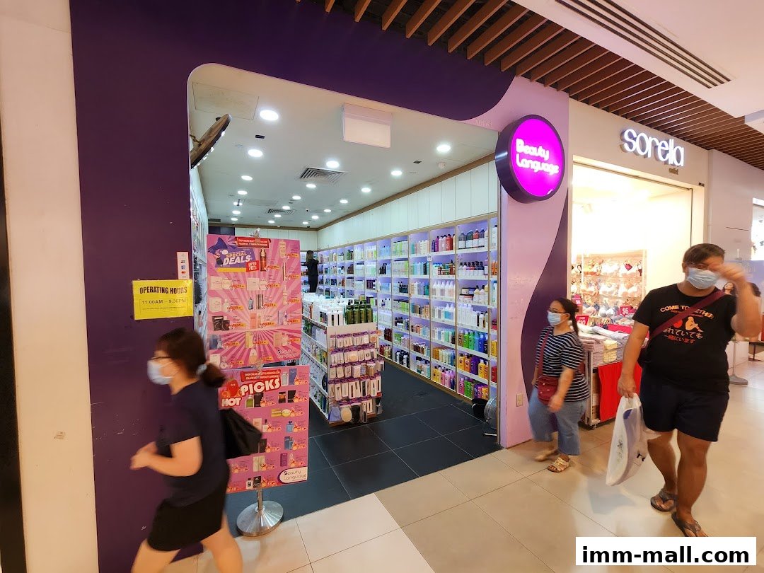 The entrance to Beauty Language, a shop filled with beauty products, with customers walking by.