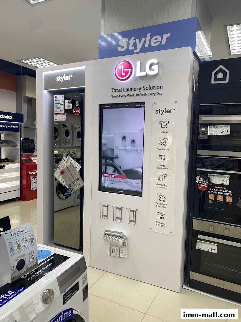 Display of LG Styler laundry solutions and other home appliances in a retail store.