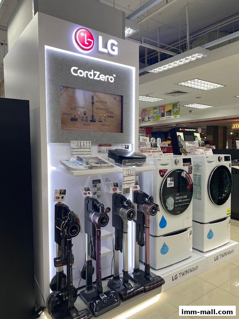 LG CordZero vacuums and LG TwinWash washing machines on display in a retail store.