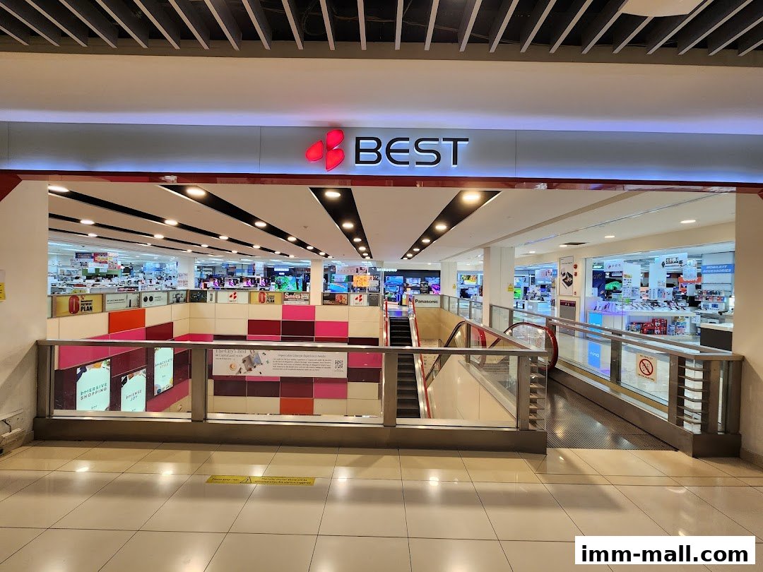 The entrance to Best Denki, an electronics store, showcasing various products and displays.