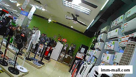Interior view of an electronics store showcasing various fans and air conditioners.
