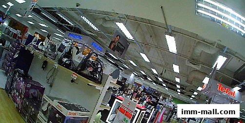 Interior view of a Best Denki electronics store showcasing various appliances and brands.