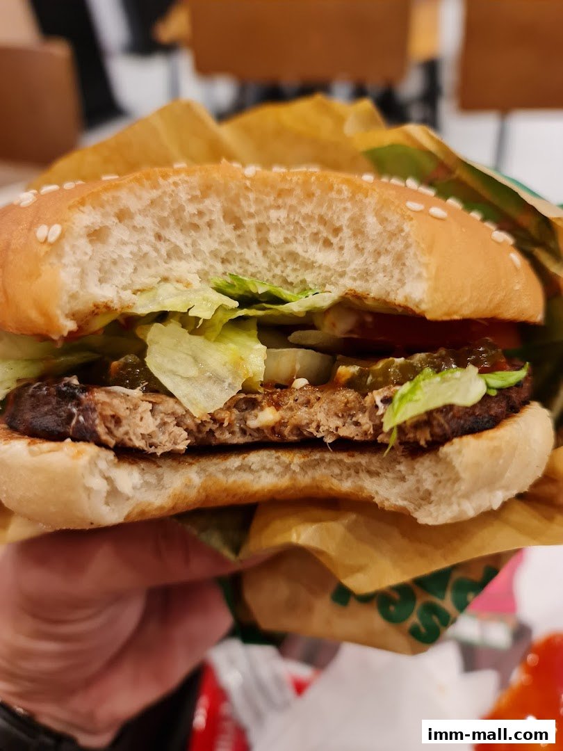 A close-up shot of a partially eaten Whopper burger from Burger King.