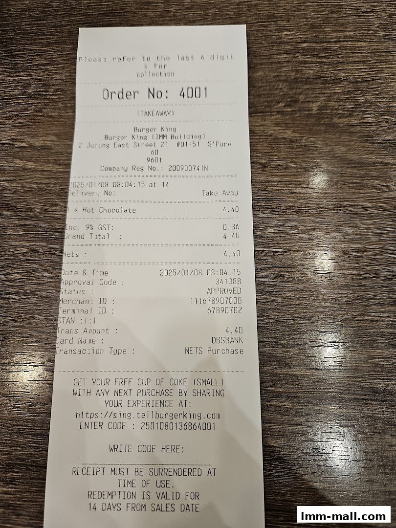 A Burger King receipt showing an order for hot chocolate and a promotion for a free coke.