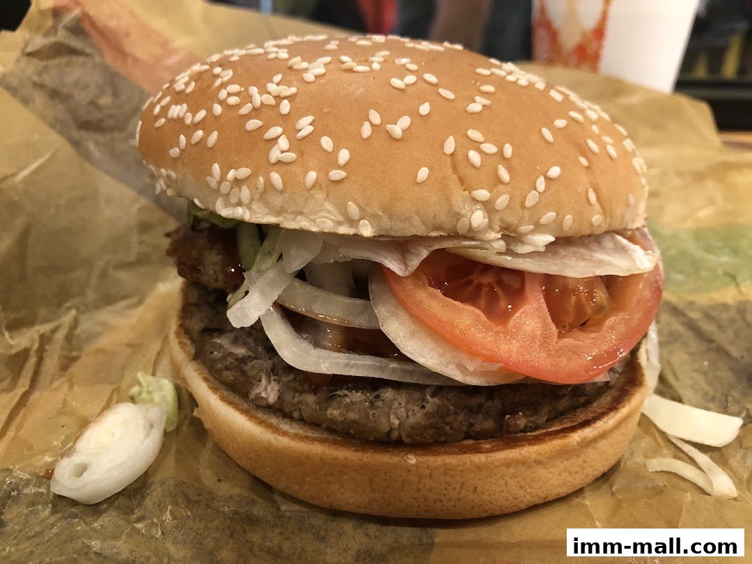 A close-up shot of a delicious Burger King Whopper with fresh toppings.