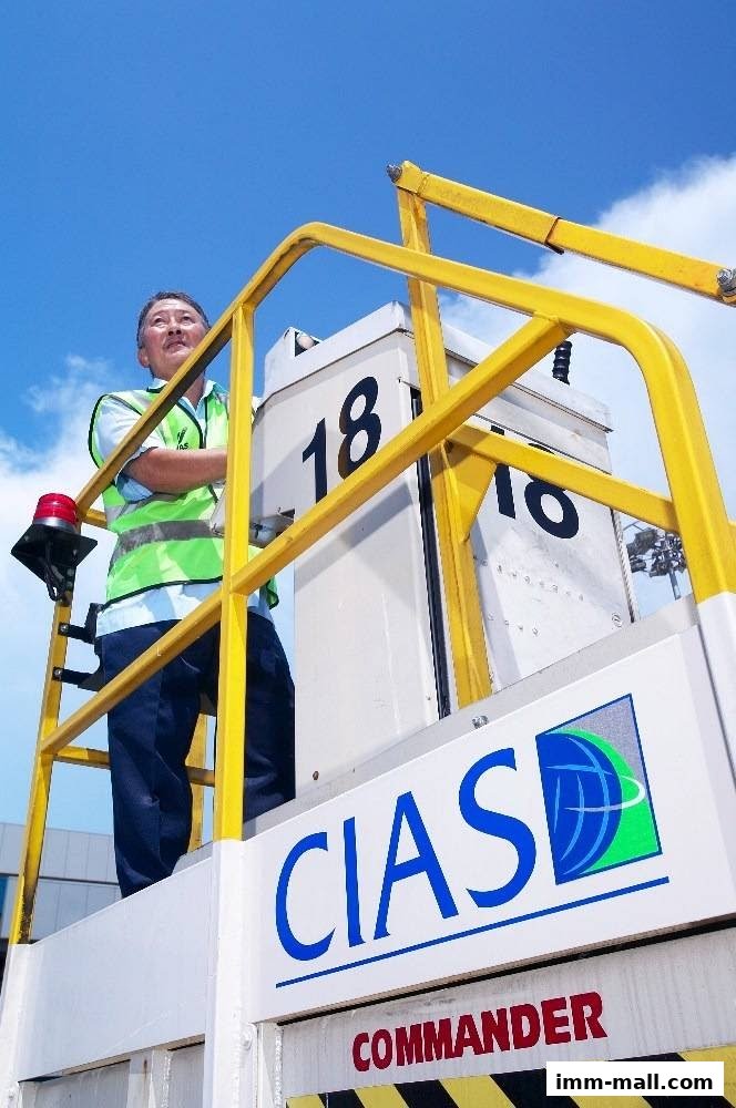 A man in a safety vest stands on a platform with the CIAS logo and the word COMMANDER visible.