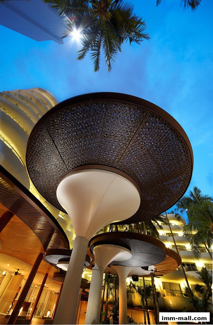 Modern architectural design with unique mushroom-shaped pillars and patterned canopies.