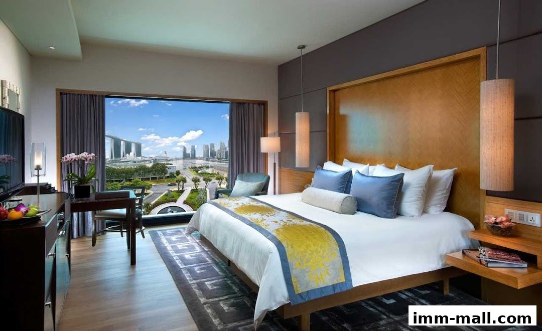 A luxurious hotel room with a king-size bed and a stunning city view.