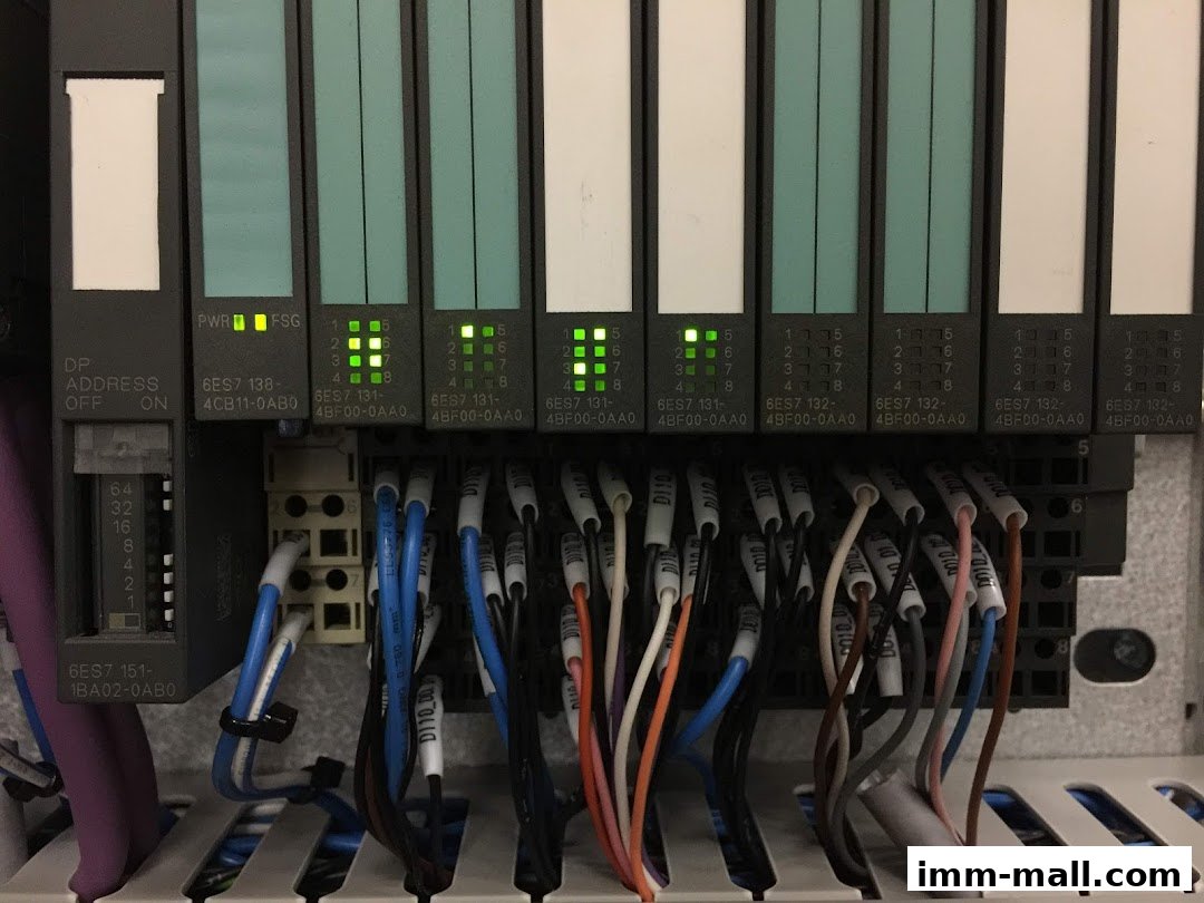 Close-up of industrial automation control modules with visible wiring and indicator lights.