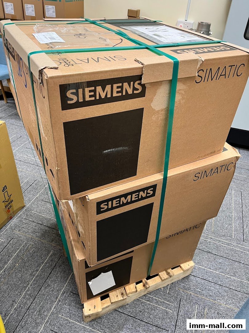 Stack of Siemens SIMATIC boxes secured with green straps on a pallet.