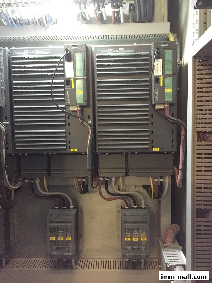 Close-up view of industrial electrical control panels with Siemens Sinamics drives.