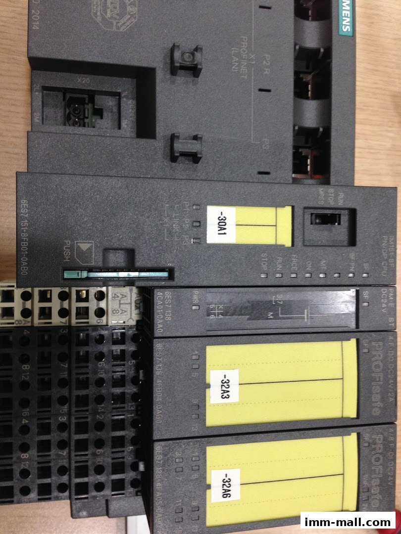 Close-up of industrial automation components, likely Siemens PLCs and modules.