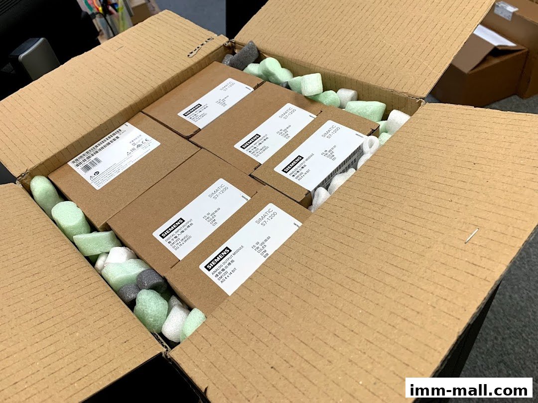 A cardboard box filled with Siemens SIMATIC S7-1200 modules and protective packaging.