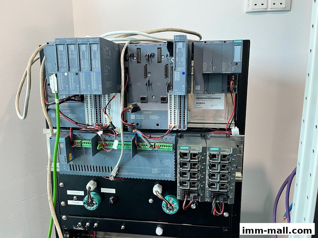 A rack of industrial automation equipment, featuring Siemens PLCs and network switches.