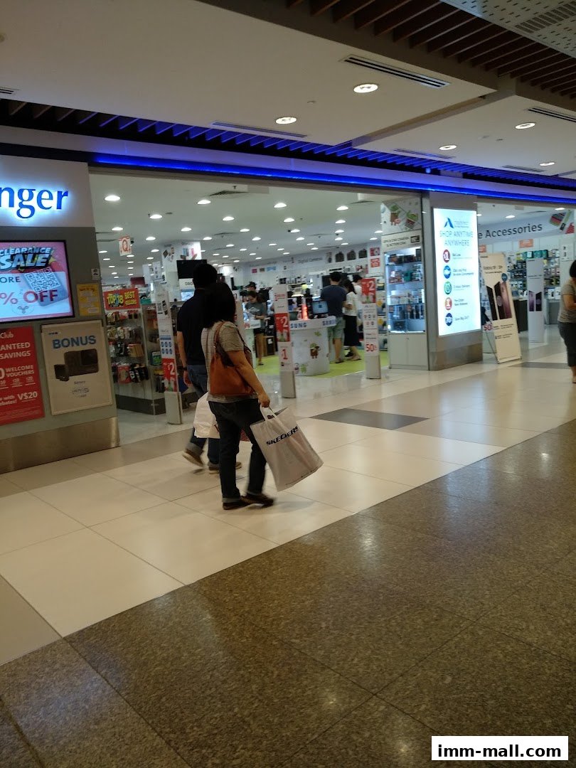 The entrance to Challenger IMM electronics store with people shopping inside.