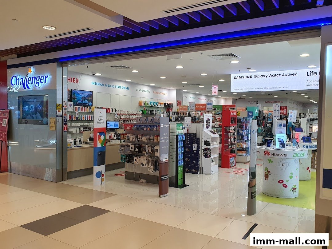 The entrance of Challenger, an electronics store, showcasing various gadgets and displays.