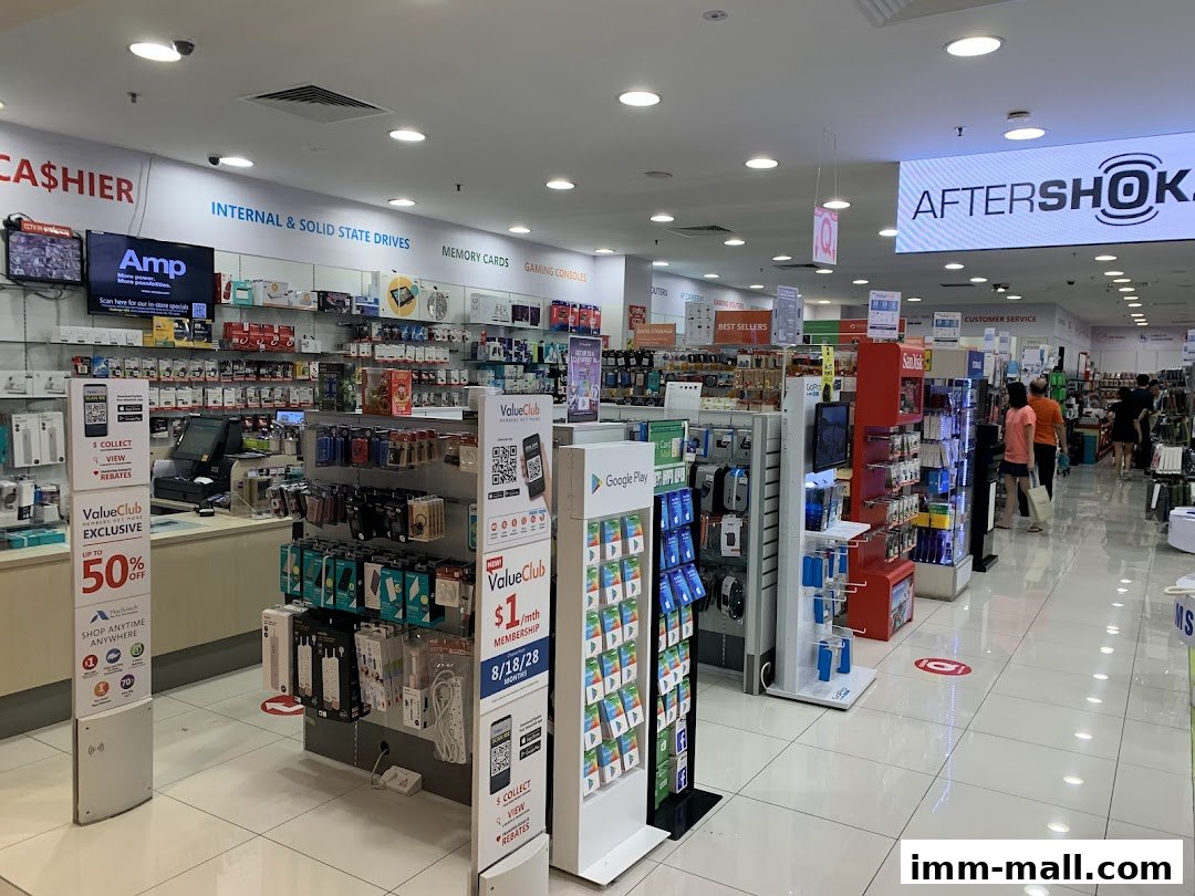 Interior view of a Challenger electronics store with various products and signage.