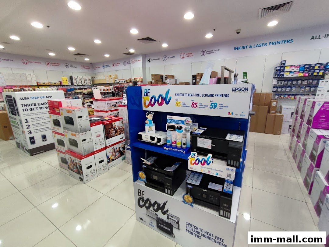 Interior view of a Challenger electronics store showcasing printers and related products.