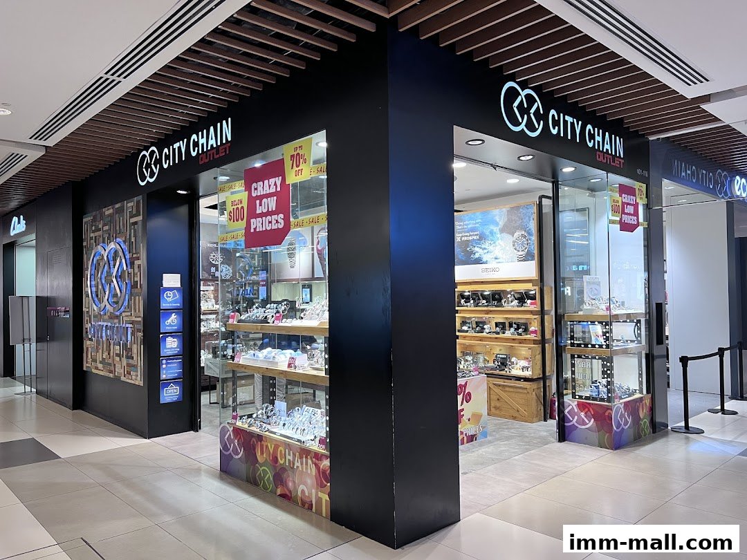 City Chain Outlet store showcasing watches with sale signs and displays.