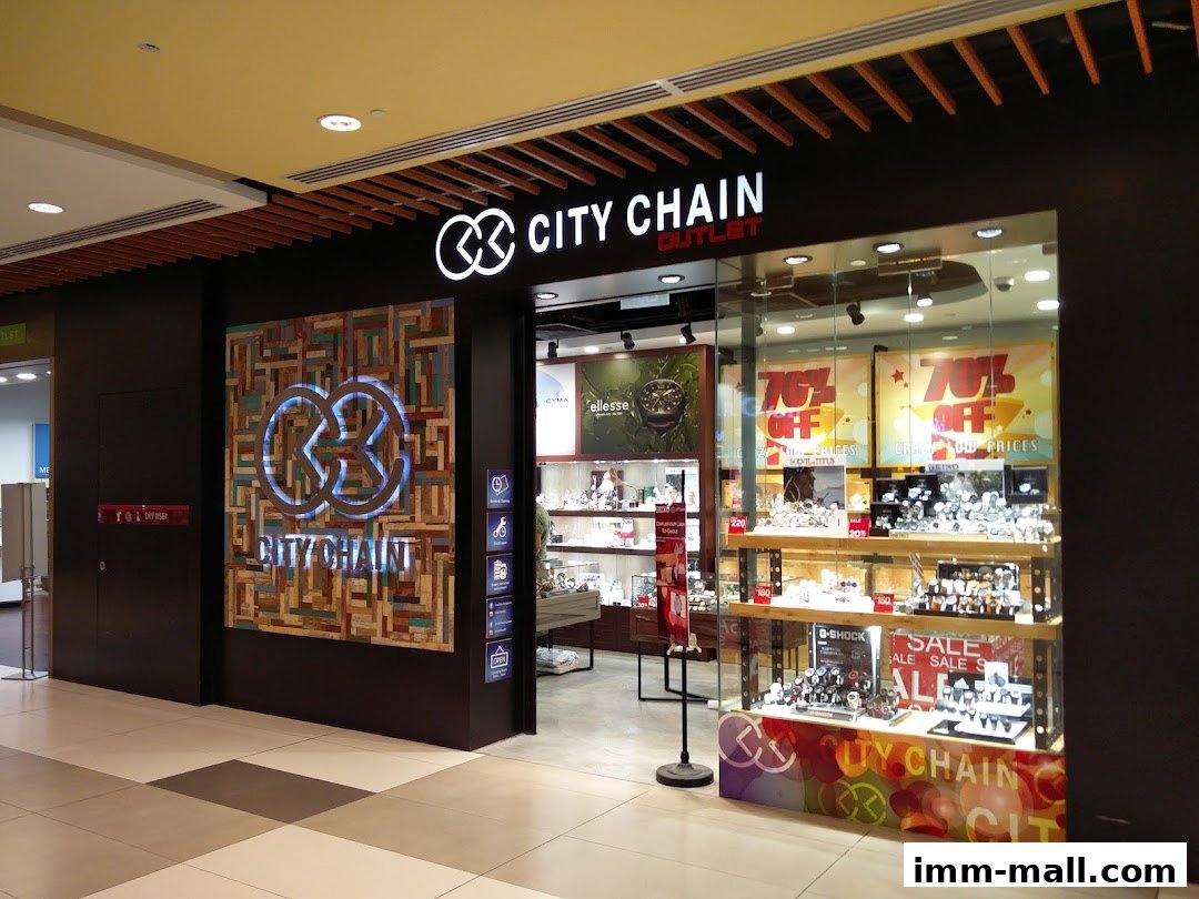 The City Chain Outlet store features a modern facade with a large display window showcasing watches and sale signs.