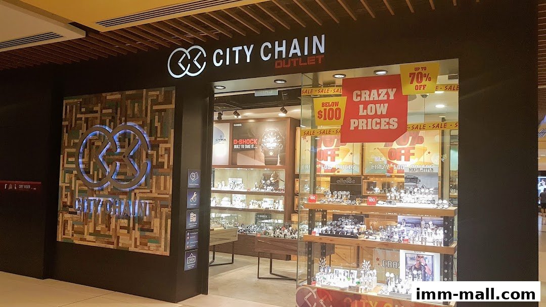 City Chain Outlet store showcasing watches with sale signs and a large branded logo.