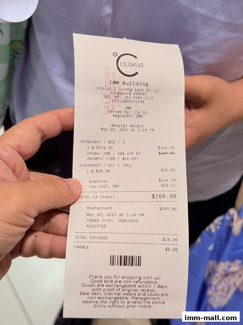 A receipt from COLDWEAR IMM Outlet showing purchase details and savings.