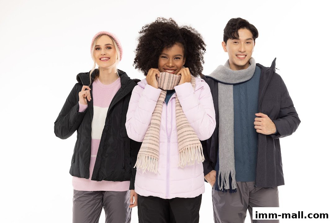 Three models smiling and wearing winter clothing from COLDWEAR IMM Outlet.