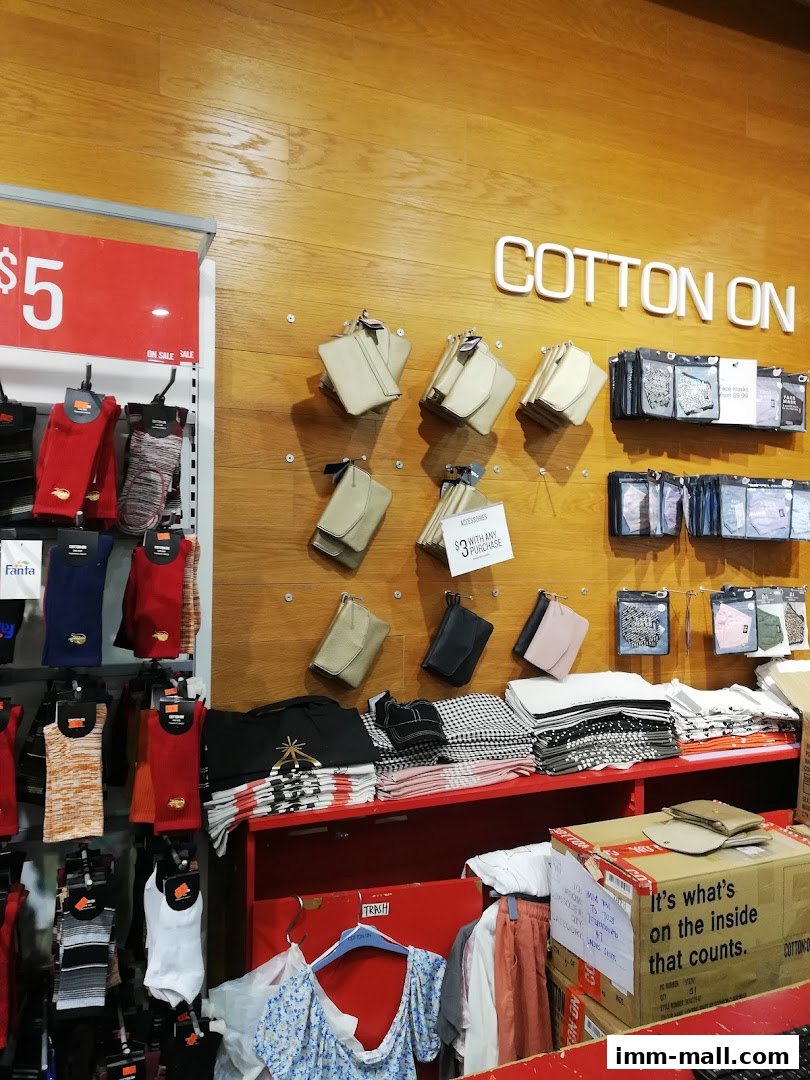 Interior view of a Cotton On store showcasing socks, accessories, and folded apparel.