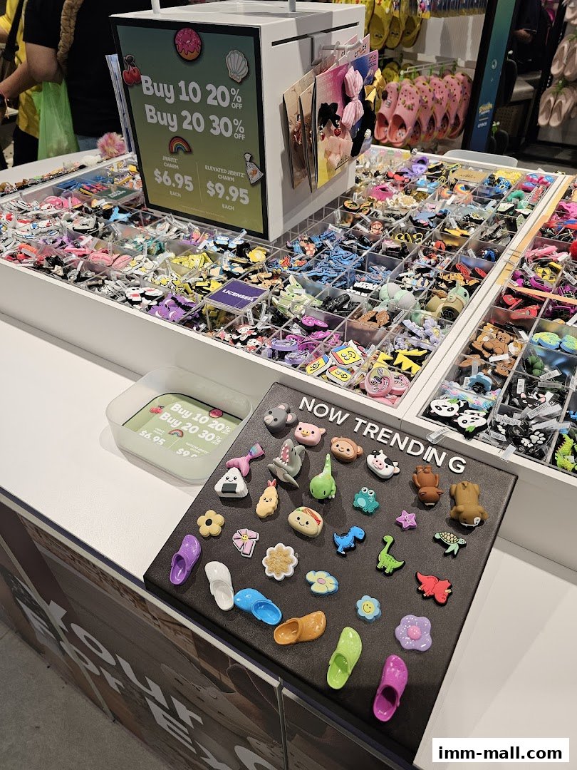 A display of colorful Jibbitz charms and accessories for Crocs shoes.